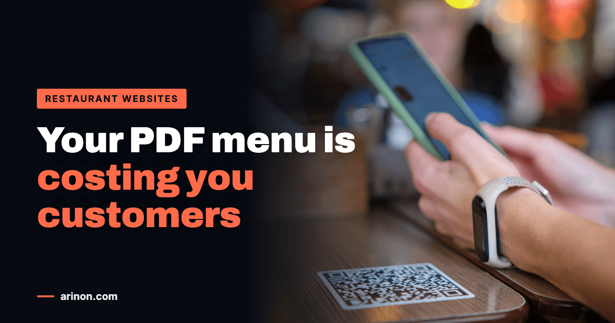 Diner scanning a table QR code with a phone to open a restaurant menu