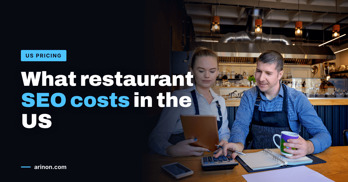 Two restaurant owners in aprons going over accounts with a calculator and tablet