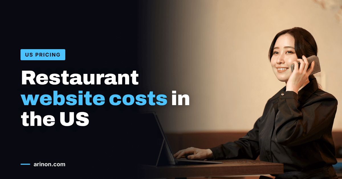 Restaurant manager on the phone while typing on a tablet at a dining table