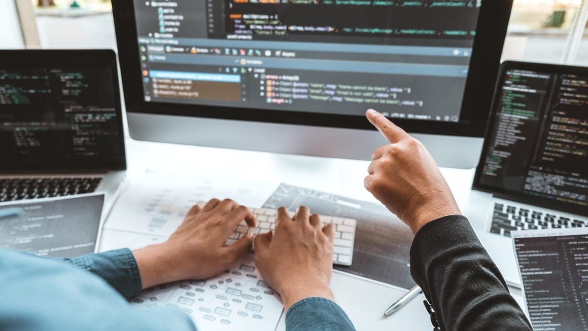 Web developer writing code for a new website