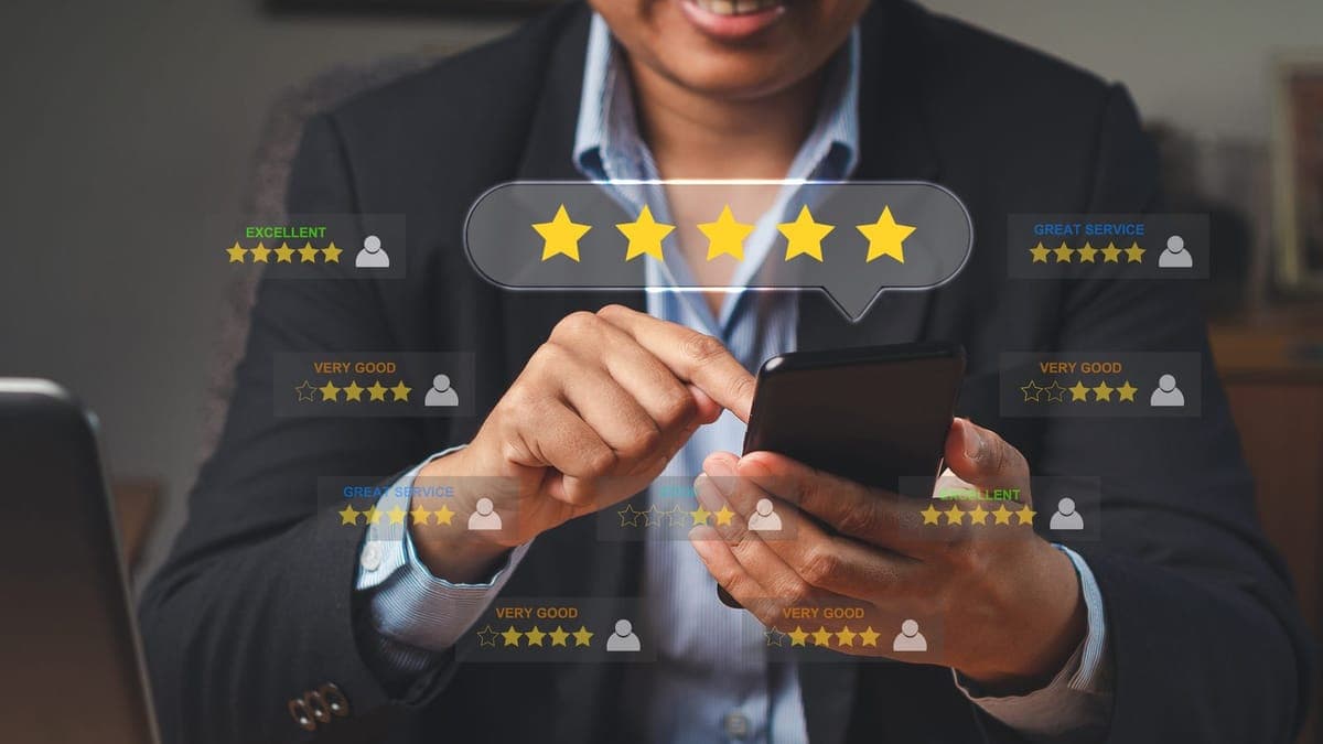 Customer giving a five-star rating on a smartphone